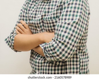 Close Up Of Asian Man With Folded Arms In Front Of Chest.