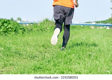 Close Up Of Asian Man Running Outdoor