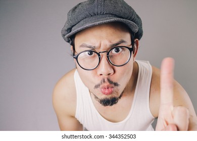 Close up of Asian man is waving his finger to show it incorrect. - Powered by Shutterstock