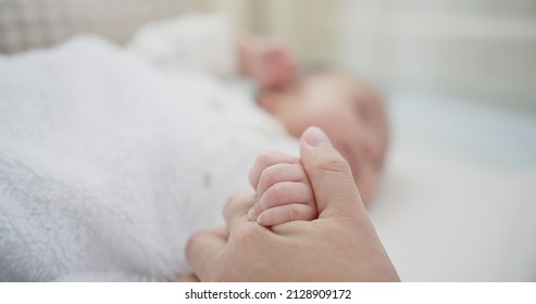 Close Up Asian Mother Holding Newborn Baby Infant Hand While Lying On The Back, Happiness Family, Love, New Life, Parenthood, Childhood Concept	
