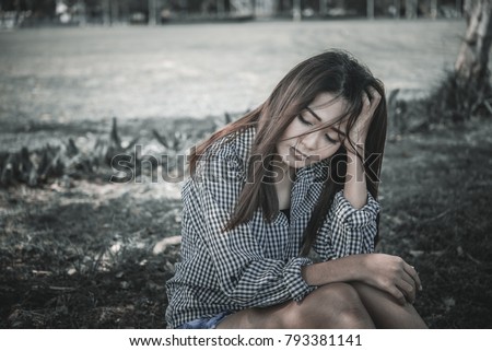 Close up asian sad woman heartbreak from From unrequited love,Brokenheart young girl concept,vintage style,dark tone
