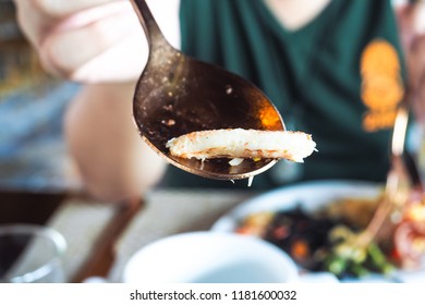 Close Up Of Asian Woman  Eating Crab Meat And Spaghetti At Resort Restaurant In The Morning.