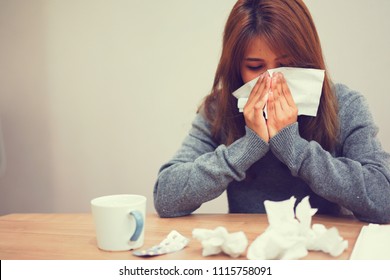 close up asian woman holding tissue in hand for reaction sneezing after feeling sick for healthcare and coronavirus (cove-19) infection disease concept - Shutterstock ID 1115758091