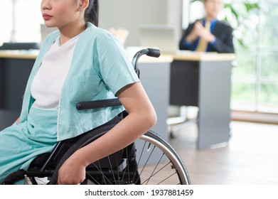 Close Up Of Asian Woman Office Worker In Wheelchair, Disabled People Working With Colleague At Workplace