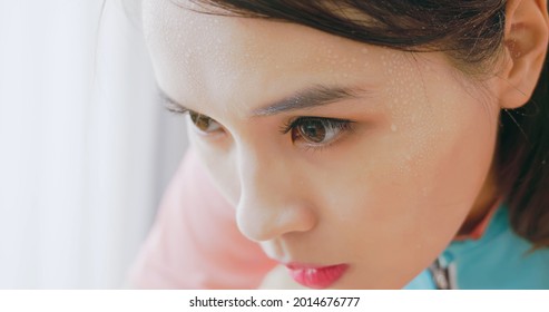 Close Up Of Asian Woman With Sweat On Face While Doing Exercise