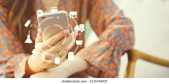 close up asian woman using smartphone mobile for make payment of credit card at home office with virtual interface of shopping online (b2b) technology concept
