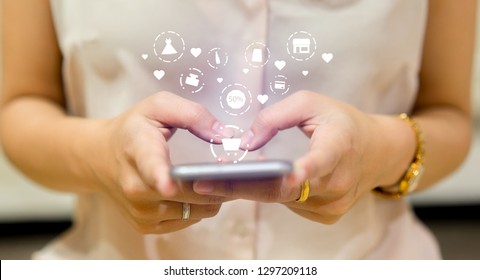 Close Up Asian Woman Using Smartphone For Choosing Item In Marketplace On Store Website With Virtual Interface Of Shopping Online (b2b) Technology Concept