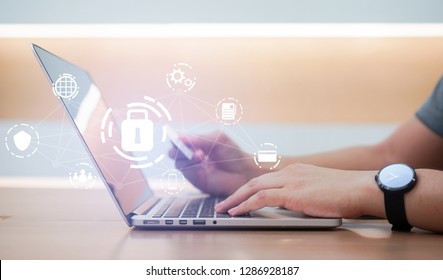 Close Up Asian Working Man Use Credit Card For Payment On Laptop At Home Office With Virtual Interface Of GDPR (General Data Protection Regulation ) , Privacy Personal Data Concept