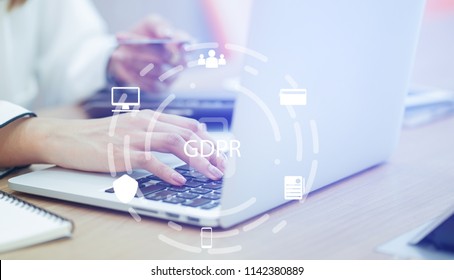 Close Up Asian Working Woman Use Credit Card For Payment On Laptop At Home Office With Virtual Interface Of GDPR (General Data Protection Regulation ) , Privacy Personal Data Concept