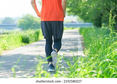 Close Up Of Asian Young Man Running Outdoor