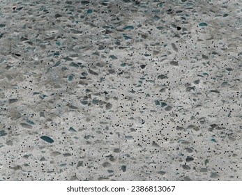 A close up of asphalt and stones with inverted coloring to provide a light background taken in Arizona in 2006.