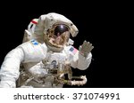 Close up of an astronaut isolated on black background - elements of this image are provided by NASA