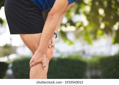 Close up athlete man, Knee pain after exercise .It happens often in athletes practice overtain.In arthritis concept.