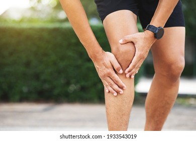 Close up athlete man, Knee pain after exercise .It happens often in athletes practice overtain.In arthritis concept.