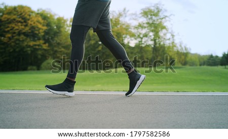 Similar – feet of a man standing inside a big puddle after a heavy rain