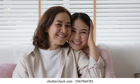 Close Up Attractive Beautiful Two Asia People Face Cheek Smile To Camera Authentic Real Family Mum And Adult Kid In Woman Power Day, Diverse Ethnic People, Genes Genetics Ginger Mom Skincare Concept.