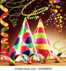 Close up Attractive Party Hats and Paper Streamers Placed on Platform, with Golden Granules, with Abstract Brown Background. - Shutterstock ID 244408834