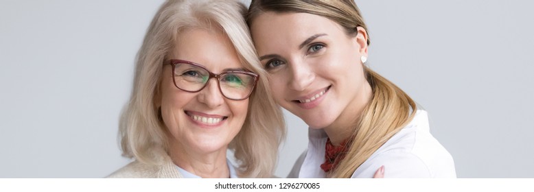 Close Up Attractive Women Faces Smile Look At Camera, Aged Mother Young Daughter, Different Generations Good Warm Relations Concept Horizontal Banner For Website Header Design With Copy Space For Text