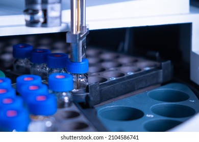 Close up auto sampler collect sample for HPLC analysis. Chromatographic separation of compounds. Metabolomic and Proteomic analysis - Shutterstock ID 2104586741