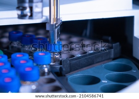 Close up auto sampler collect sample for HPLC analysis. Chromatographic separation of compounds. Metabolomic and Proteomic analysis