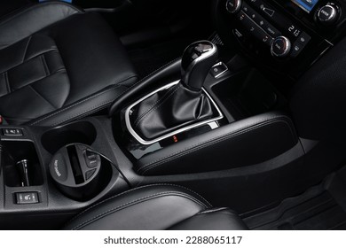 Close up of the automatic gearbox lever, black interior car, Automatic transmission gearshift stick. Closeup a manual shift of modern car gear shifter.