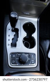 Close up of the automatic gearbox lever, blackinterior car; Automatic transmission gearshift stick