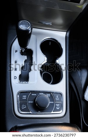 Close up of the automatic gearbox lever, blackinterior car; Automatic transmission gearshift stick
