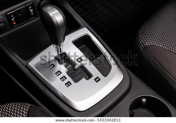 Close up of the automatic\
gearbox lever, blackinterior car; Automatic transmission gearshift\
stick;