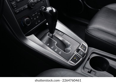 Close up of the automatic gearbox lever, Automatic transmission gearshift stick. Closeup a manual shift of modern car gear shifter.