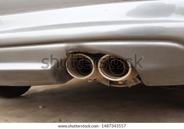 close up\
automotive exhaust pipe, exhaust of\
car.