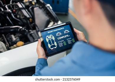 Close Up Of Automotive Mechanic Running Diagnostics Software On Tablet. Asian Young Vehicle Service Manager Worker Work In Mechanics Garage, Check And Maintenance To Repair The Engine Car In Workshop.