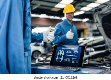 Close Up Of Automotive Mechanic Running Diagnostics Software On Tablet. Asian Young Vehicle Service Manager Worker Work In Mechanics Garage, Check And Maintenance To Repair The Engine Car In Workshop.