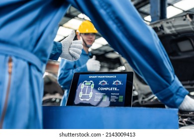 Close Up Of Automotive Mechanic Running Diagnostics Software On Tablet. Asian Young Vehicle Service Manager Worker Work In Mechanics Garage, Check And Maintenance To Repair The Engine Car In Workshop.