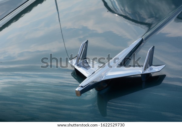 Close up of aviation\
style hood ornament