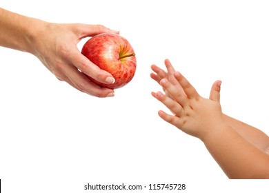 Close Up Of Babies Hands Reaching Out To Apple.Isolated On White.