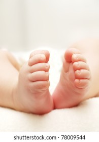 Close up of baby feet, isolated towards white background - Shutterstock ID 78009544