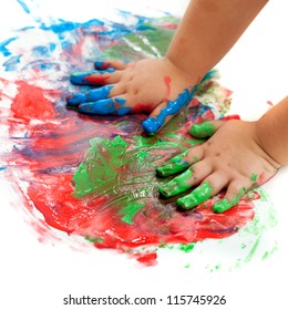 Close Up Of Baby Hands Painting Mosaic.