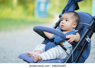 Close Up Baby In Stroller. Happy Baby Concept.Asia Baby.