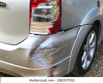 Close Up Back Of Mini Van (MPV Car) Get Damaged From Accident On The Road. Vehicle Bumper Dent And Taillight Broken By Car Crash. Road Accidents And Car Insurance Concept.