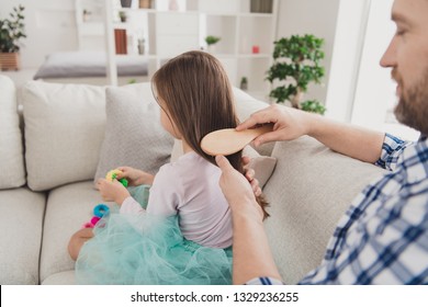 Close up back rear behind photo little she her girl he him his guy father hair making pigtails ponytails braids morning before kindergarten wear jeans denim checkered plaid shirt house sit cozy divan - Powered by Shutterstock