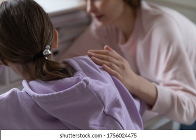 Close Up Back View Of Caring Mom Touch Comfort Upset Teenage Daughter Having Difficulties With Studying At Home, Supportive Loving Mother Caress Console Sad Teen Child Suffering From School Problems