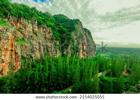 The close background of the green rice fields, the seedlings that are growing, are seen in rural areas as the main occupation of rice farmers who grow rice for sale or living.