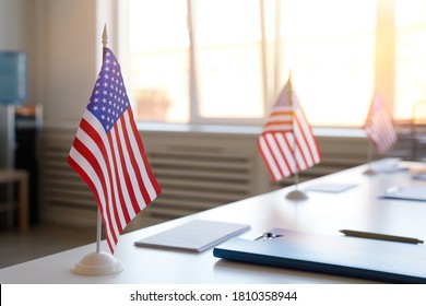 Close up background image of empty polling station decorated with American flags on election day, copy space - Shutterstock ID 1810358944