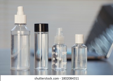 Close Up Background Image Of Various Hand Sanitizers On Empty Workplace Desk In Post Pandemic Office, Copy Space