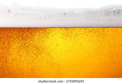 Close Up Background Texture Of Lager Beer With Bubbles And Froth In Glass, Low Angle Side View