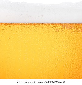 Close up background texture of pouring lager beer with bubbles and froth in frosty glass with drops, low angle side view - Powered by Shutterstock