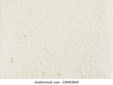 close up background and texture of stretch marks cracked on white cream glazed tile