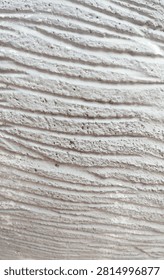 Close up background texture of white decorative wall with wavy lines pattern