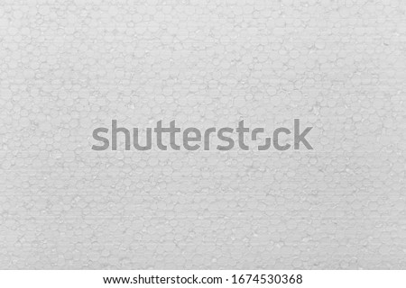 Close up background texture of white expanded polystyrene construction board panel