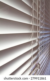 Close up background of white wooden venetian blinds in a modern home